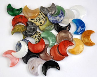 May include: A collection of 20 crescent moon shaped polished stones in various colors and patterns, including green, red, white, black, blue, and brown.