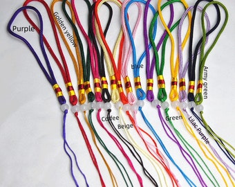 May include: Assortment of 16 colorful cords with a white bead at the end of each cord. The cords are arranged in a row, with the colors labeled above each cord. The colors are: dark red, dark green, hot pink, red, pink, red purple, yellow, black, purple, golden yellow, blue, army green, coffee, beige, green, lilac purple.