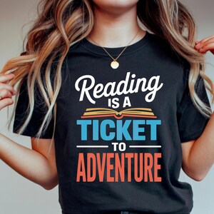 Black t-shirt with "Reading is a ticket to adventure" text.