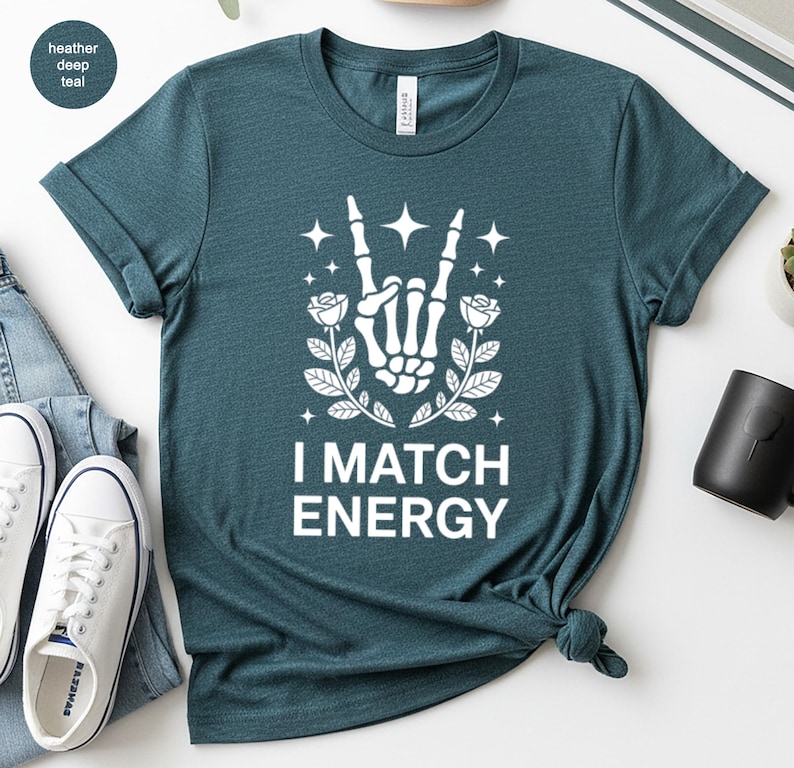 I Match Energy Skeleton Hand Shirt, Rock On Gesture with Roses and Stars Tee, Teal Aesthetic Vibe, Goth Alt Gift
I Match Energy, Skeleton