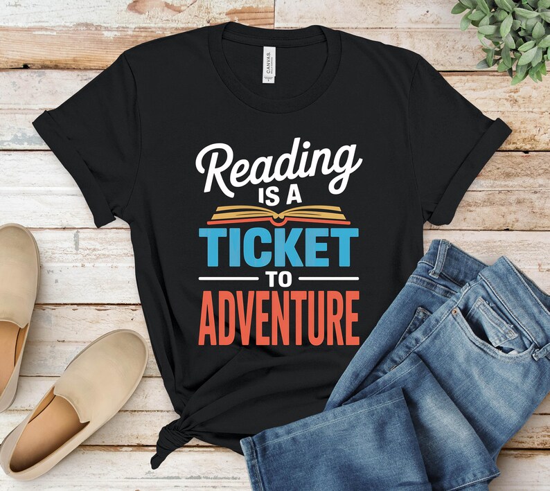 Black t-shirt with "Reading is a ticket to adventure" text.
