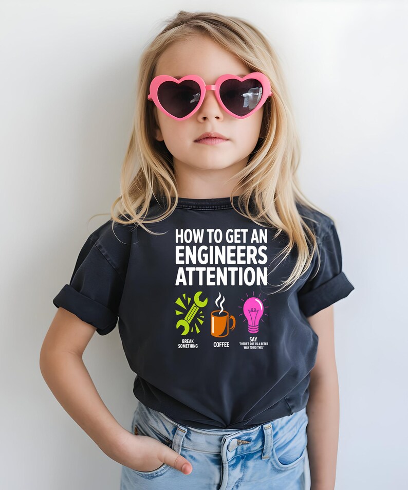 T-shirt with "How to Get an Engineer's Attention" design.