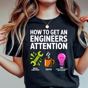 T-shirt with "How to Get an Engineers Attention" and humorous steps.