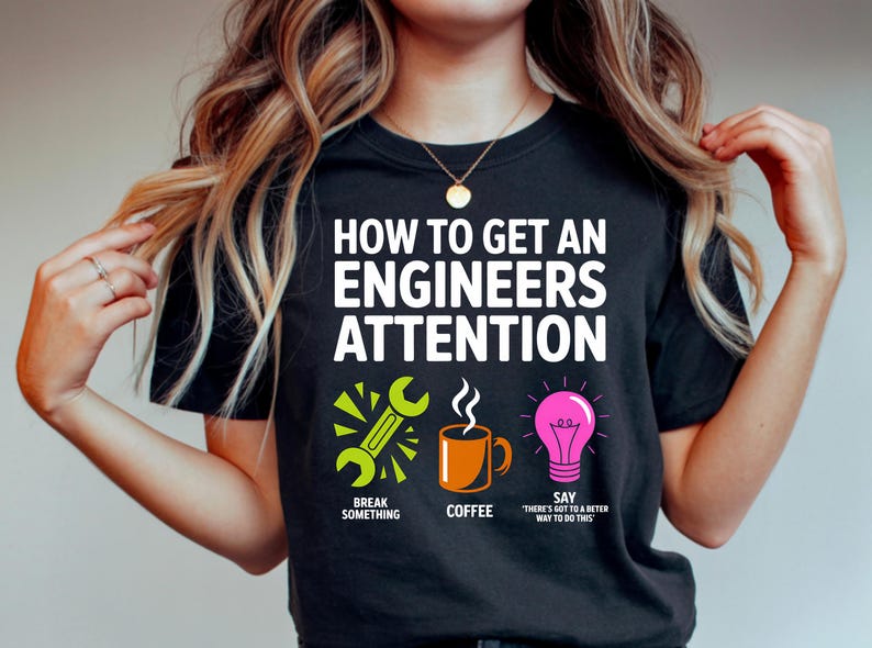 T-shirt with "How to Get an Engineers Attention" and humorous steps.