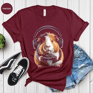 Guinea Pig Headphones T-Shirt, Cute Animal Graphic Tee, Funny Pet Lover Gift, Casual Maroon Top, Women’s Novelty Apparel