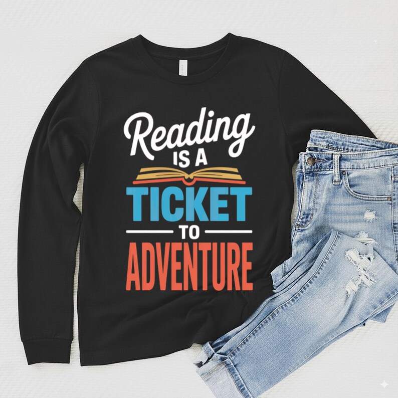Black long sleeve shirt with "Reading is a ticket to adventure" text design.