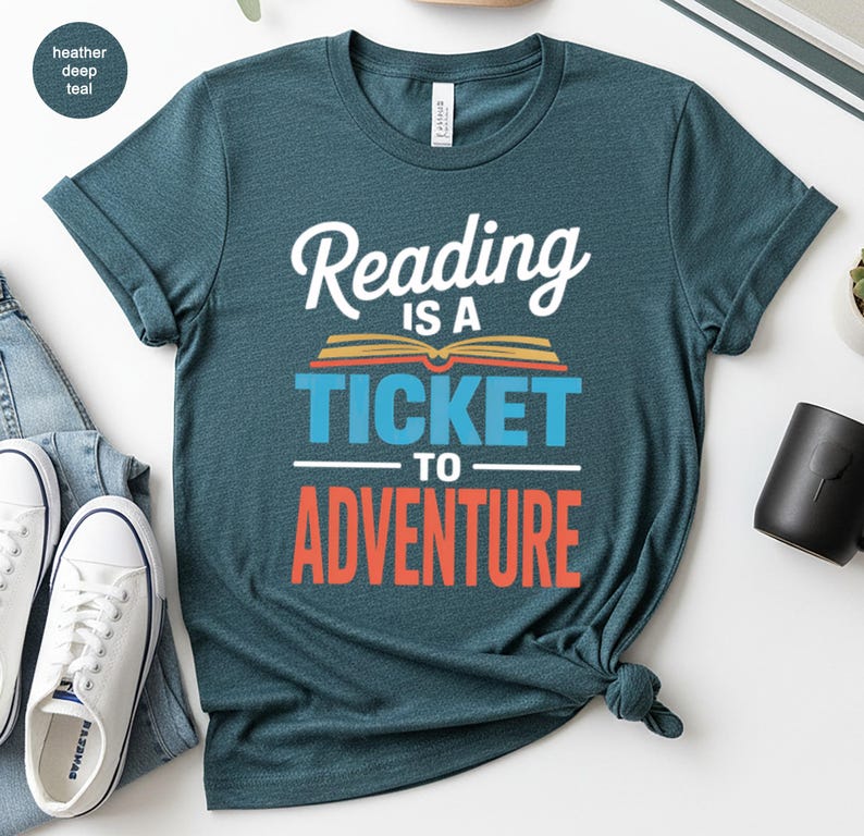 Teal t-shirt with "Reading is a ticket to adventure" text.