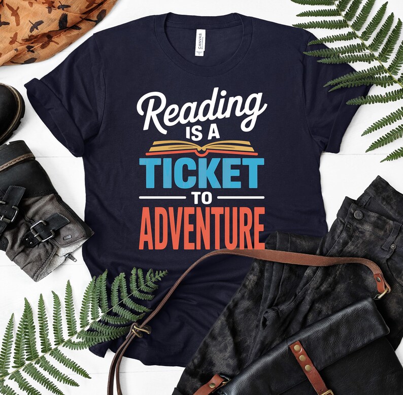 Navy t-shirt with "Reading is a ticket to adventure" text.