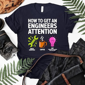 T-shirt with "How to Get an Engineer's Attention" graphic, featuring coffee and a lightbulb.