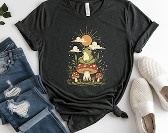 Peaceful Frog on Mushroom T-Shirt, Whimsical Toad Tee, Boho Sun and Cloud Design, Mystical Nature Lover Gift, Cottagecore Aesthetic T-Shirts
