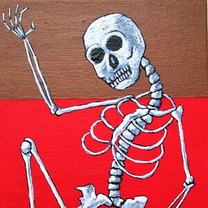 May include: A white skeleton painted on a red and brown background. The skeleton is sitting with its left arm raised and its right arm bent at the elbow. The skeleton's skull is facing the viewer.
