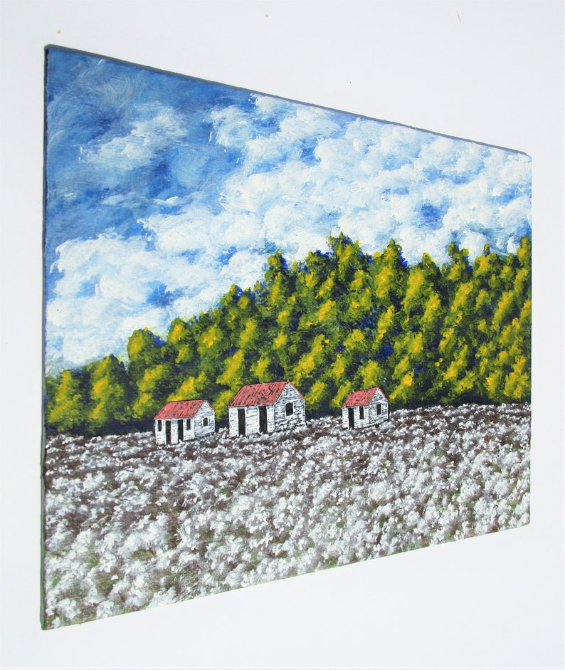 May include: A painting of a rural landscape with three white houses with red roofs in a field of white flowers. The houses are set against a backdrop of green trees and a blue sky with white clouds.
