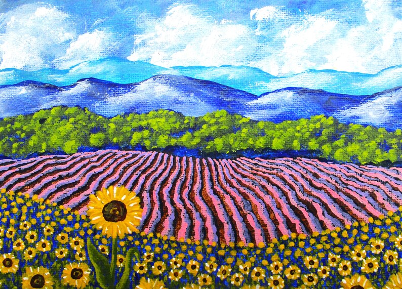 May include: A painting of a field of lavender with sunflowers in the foreground. The lavender is a light purple color and the sunflowers are yellow with brown centers. The background is a blue sky with white clouds and a row of green trees in front of a blue mountain range.
