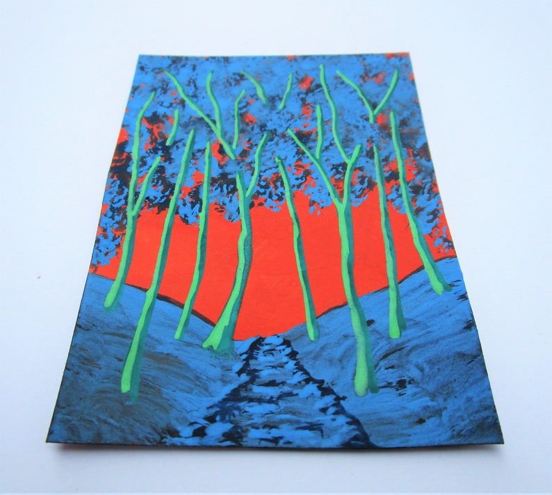 May include: A painting depicting a forest scene with green trees against a bright orange sky. The trees are painted in a stylised way, with thick, dark blue trunks and green branches. The sky is a vibrant orange, with a hint of pink at the edges. The painting is done on a textured surface, giving it a rough, almost abstract look.