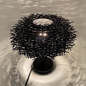 table lamp,bedside table lamp,desk lamp,housewarming table lamp,nightstand lamp,Handmade table lamp
Rattan woven light
Bohemian decor
Natural rattan lamp
Wooden base lamp
Eco-friendly lighting
Rustic table light
Unique home decor
Customizable lamp
Handcrafted fixture
Modern boho lamp
Gift for home
Sustainable decor