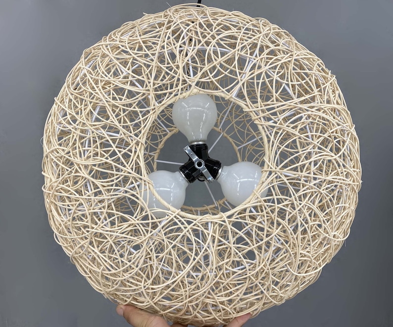 rattan pendant light
handwoven lighting
boho decor
rustic light fixture
handmade pendant
ceiling lamp
artisan lighting
eco friendly lamp
coastal chandelier
farmhouse lighting
rattan pendant light,handmade woven lampshade,  
bohemian ceiling light, eco-friendly lighting, natural fiber lamp,  
jungle decor, sustainable home decor, macrame pendant light,  
tropical chandelier, 
Chandelier
Ceiling Light Fixture
Pendant Light
Modern Chandelier
Vintage Chandelier
Rustic Chandelier
Farmhouse Chandelier