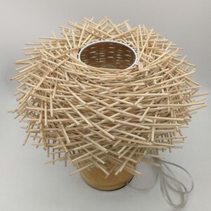table lamp,bedside table lamp,desk lamp,housewarming table lamp,nightstand lamp,Handmade table lamp
Rattan woven light
Bohemian decor
Natural rattan lamp
Wooden base lamp
Eco-friendly lighting
Rustic table light
Unique home decor
Customizable lamp
Handcrafted fixture
Modern boho lamp
Gift for home
Sustainable decor