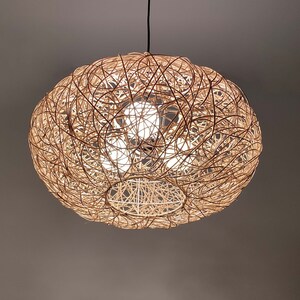 rattan pendant light
handwoven lighting
boho decor
rustic light fixture
handmade pendant
ceiling lamp
artisan lighting
eco friendly lamp
coastal chandelier
farmhouse lighting
rattan pendant light,handmade woven lampshade,  
bohemian ceiling light, eco-friendly lighting, natural fiber lamp,  
jungle decor, sustainable home decor, macrame pendant light,  
tropical chandelier, 
Chandelier
Ceiling Light Fixture
Pendant Light
Modern Chandelier
Vintage Chandelier
Rustic Chandelier
Farmhouse Chandelier