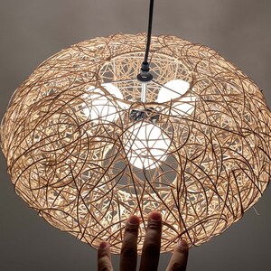 rattan pendant light
handwoven lighting
boho decor
rustic light fixture
handmade pendant
ceiling lamp
artisan lighting
eco friendly lamp
coastal chandelier
farmhouse lighting
rattan pendant light,handmade woven lampshade,  
bohemian ceiling light, eco-friendly lighting, natural fiber lamp,  
jungle decor, sustainable home decor, macrame pendant light,  
tropical chandelier, 
Chandelier
Ceiling Light Fixture
Pendant Light
Modern Chandelier
Vintage Chandelier
Rustic Chandelier
Farmhouse Chandelier