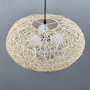 rattan pendant light
handwoven lighting
boho decor
rustic light fixture
handmade pendant
ceiling lamp
artisan lighting
eco friendly lamp
coastal chandelier
farmhouse lighting
rattan pendant light,handmade woven lampshade,  
bohemian ceiling light, eco-friendly lighting, natural fiber lamp,  
jungle decor, sustainable home decor, macrame pendant light,  
tropical chandelier, 
Chandelier
Ceiling Light Fixture
Pendant Light
Modern Chandelier
Vintage Chandelier
Rustic Chandelier
Farmhouse Chandelier