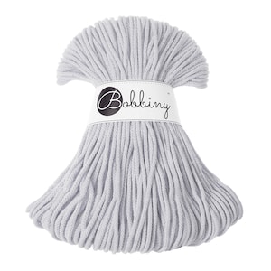 May include: A skein of light gray cotton rope, tied with a white label that reads "Bobbiny".