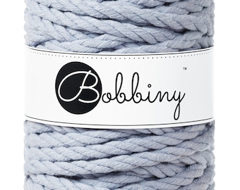 May include: A spool of light blue cotton rope with the brand name "Bobbiny" printed on a white label.