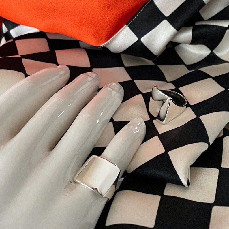 Beautiful handcarved rectangular shaped  modern shiny sterling silver ring.
