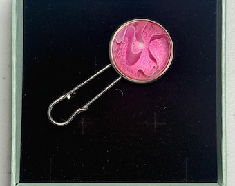 Chrome safety pin brooch with pink cabochon