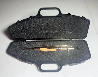Bolt-action rifle pen gold fittings with black and blonde ebony barrel.