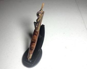 Brass and oil-rubbed bronze piston pen with mallee burl barrel