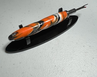 Reversible seam ripper with chrome finish in orange, black and white resin