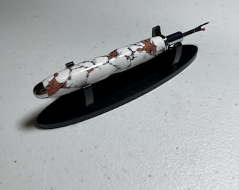 Reversible seam ripper with chrome finish in peach snd white polished clay