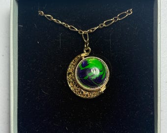 Gold moon spinner necklace with green/purple and marinara cabochons