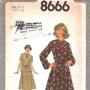 May include: Vintage Simplicity 8666 sewing pattern. The pattern features illustrations of two dresses. One is a long-sleeved dress with a floral pattern and a tie waist. The other is a short-sleeved dress with a matching tie.
