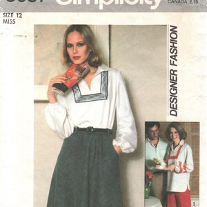 May include: Simplicity pattern 8087 featuring a woman in a white blouse with a square neckline and a dark skirt. The pattern includes the text "Designer Fashion" and "Size 12".