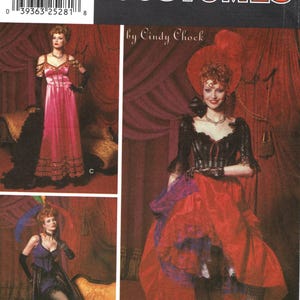 May include: Simplicity Costumes pattern featuring three vintage costume designs. The designs include a pink gown, a black and red ensemble, and a purple outfit. The pattern includes sizes 6, 8, 10, and 12.