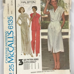 May include: A vintage McCall's 6135 sewing pattern featuring a Halston design. The pattern includes instructions for a Misses' dress or top and pants. The cover shows illustrations of the garments in various colors and styles, with size combinations listed.