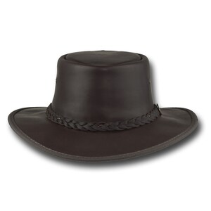 May include: A brown leather cowboy hat with a braided band around the crown.