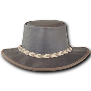 May include: A brown leather cowboy hat with a braided leather band.