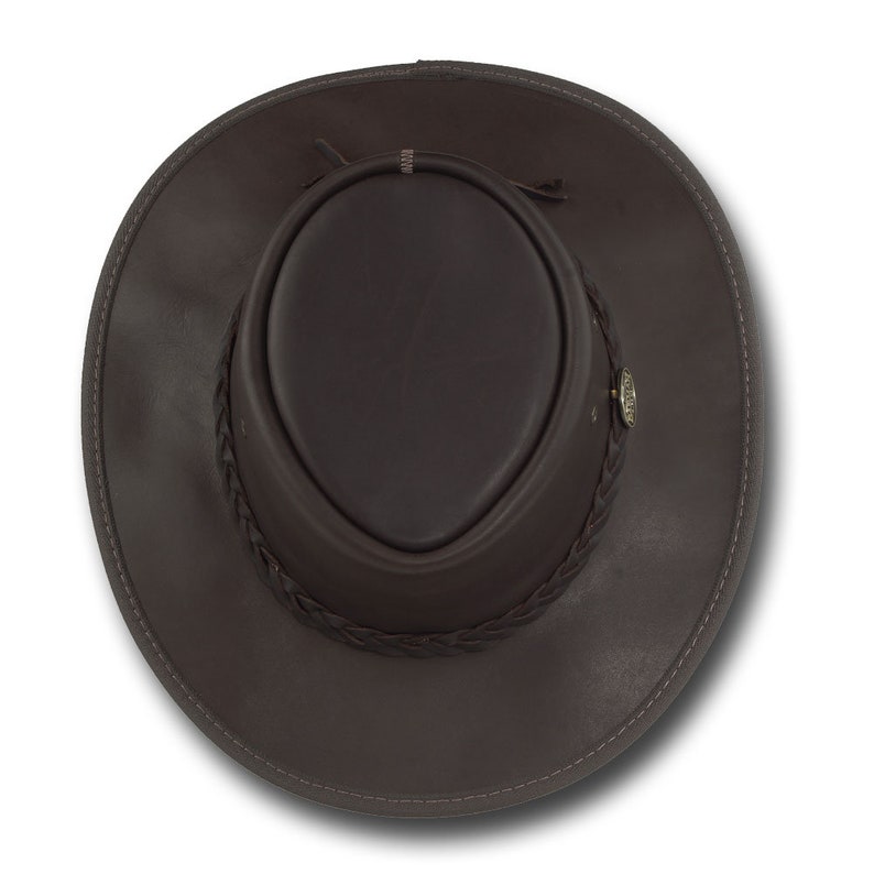 May include: A brown leather cowboy hat with a braided leather band and a small metal emblem.