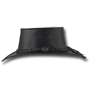 May include: A black leather cowboy hat with a braided leather band and a metal logo that says "Kangol" on it.