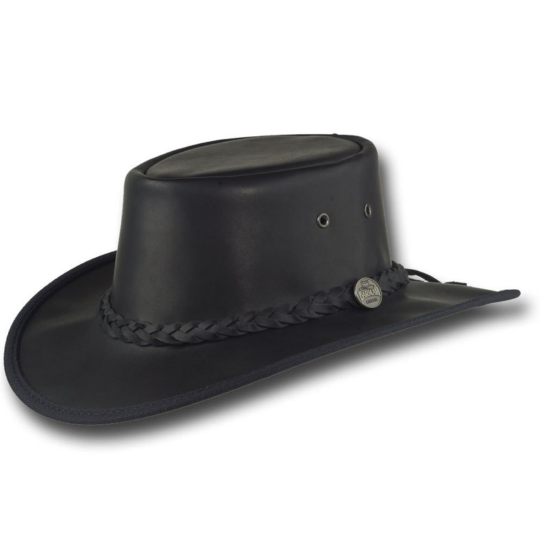 May include: A black leather cowboy hat with a braided band and a silver metal buckle. The hat has a wide brim and a tall crown.