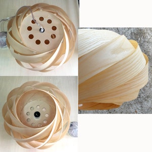May include: A natural wood pendant light fixture with a unique spiral design. The light fixture is made of thin strips of wood that are woven together to create a circular shape. The light fixture has a modern and minimalist design.