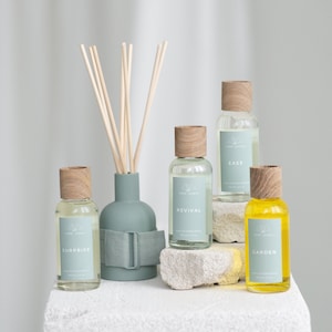 GREENISH REED DIFFUSER: Ease, Revival, Surprise, Garden. Ceramic Vase with Oak Cover, Natural Sticks & 100 ml Refill Bottle in Black Box