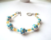 Light blue, yellow and white ceramic  bracelet , Summer bracelet. Floral bracelet.