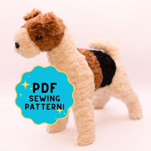 May include: A plush dog toy with a brown and cream-colored head, back, and legs. The dog has a black nose and eyes. The body has a brown, black, and cream-colored pattern. A blue and yellow graphic with the text "PDF SEWING PATTERN!" is in the foreground.