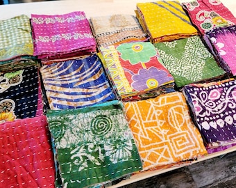 May include: A collection of colorful fabric squares with various patterns and designs. The squares are made of kantha, a traditional Indian quilting technique, and are perfect for crafting projects or home decor.