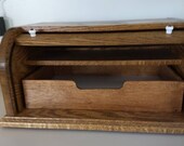This is a roll top organizer designed for the counter top or office.