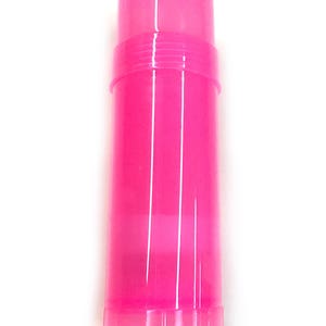 May include: A bright pink plastic tube container with a screw-on lid. The container is empty and ready to be filled with a product like lip balm or lotion.