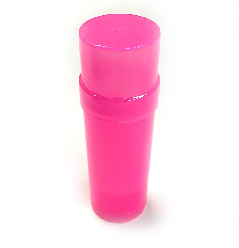 May include: A bright pink plastic container with a screw-on lid. The container is cylindrical and has a smooth surface.